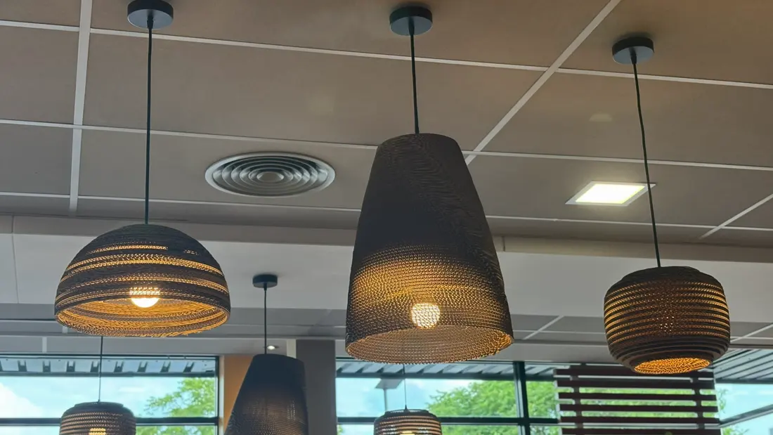 Cardboard pendant lamps installed in a restaurant